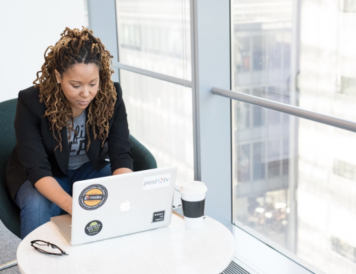 African American Woman Typing on a Laptop